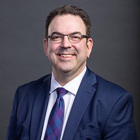 headshot of André Brin
