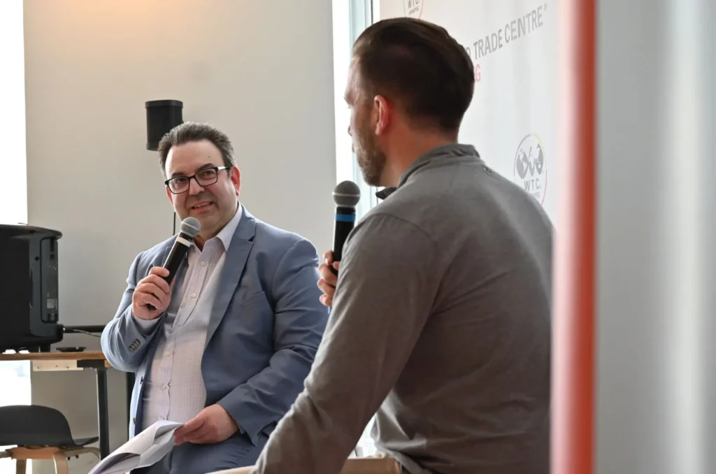Pictured left to right, Andre Brin, CEO of WTC Winnipeg, and Matthew Gale, CEO of Polysense Solutions, on stage at WTC Winnipeg's business networking event, WTC Talks, on March 18, 2026.
